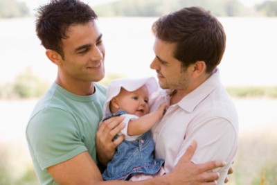 Smiling men with baby